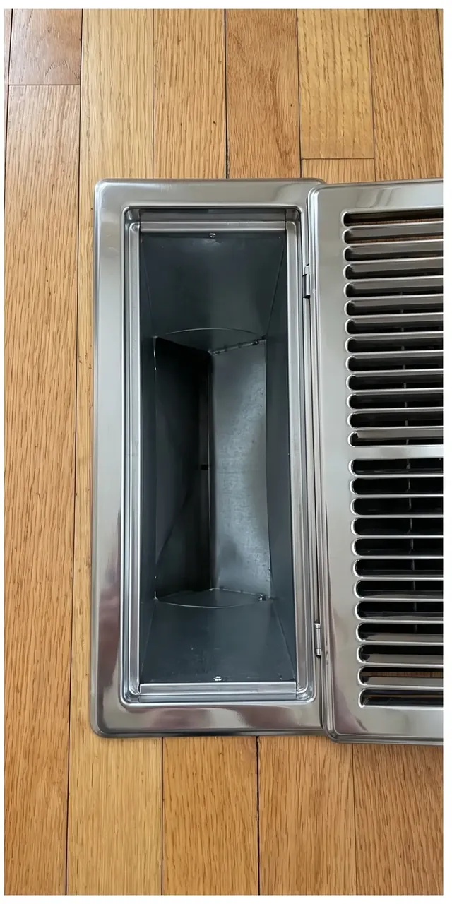 The same floor vent opening and register grille clean after professional cleaning
